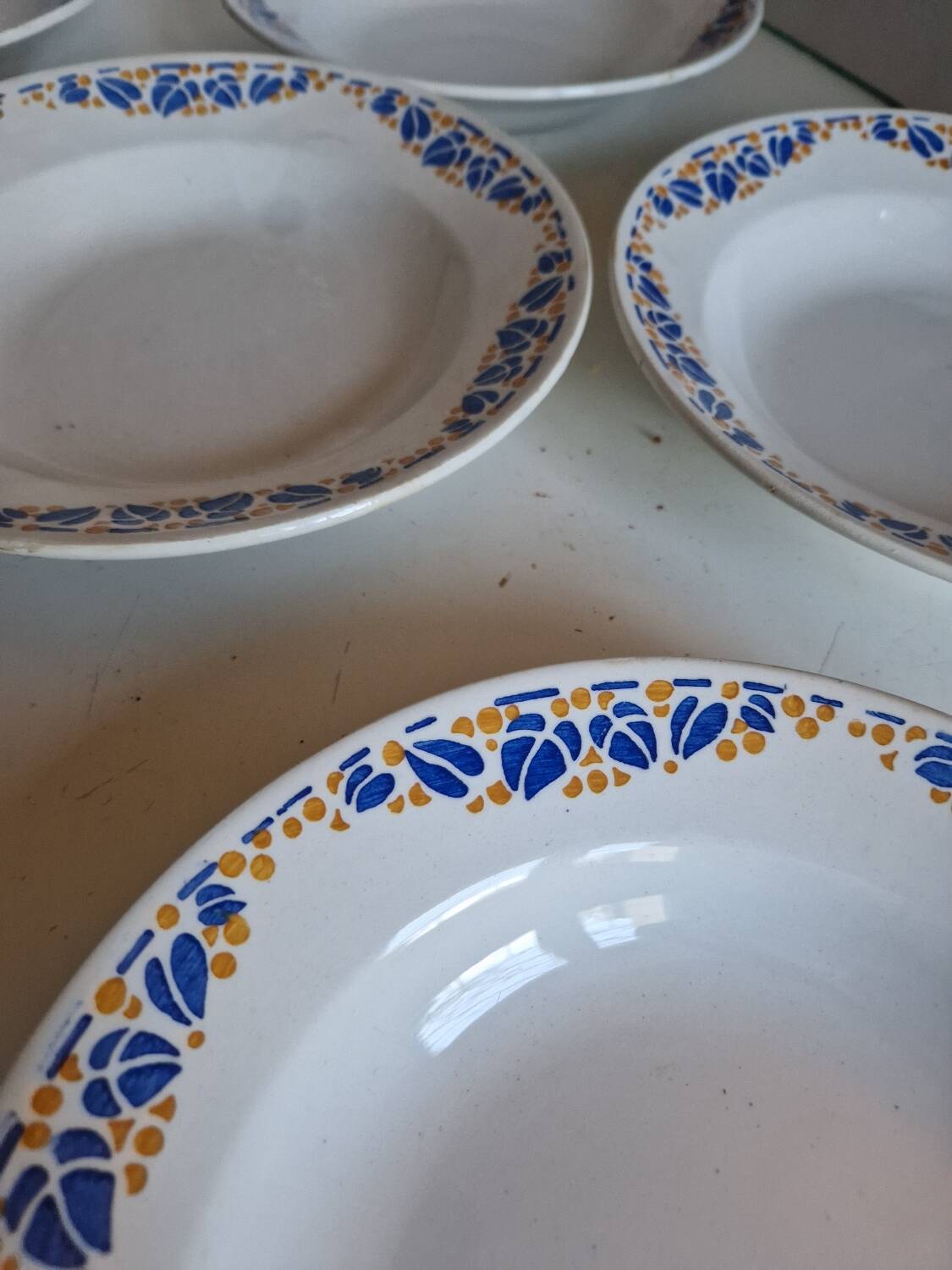 Set of 9 deep plates, earthenware from Creil Montereau, Colette model.
