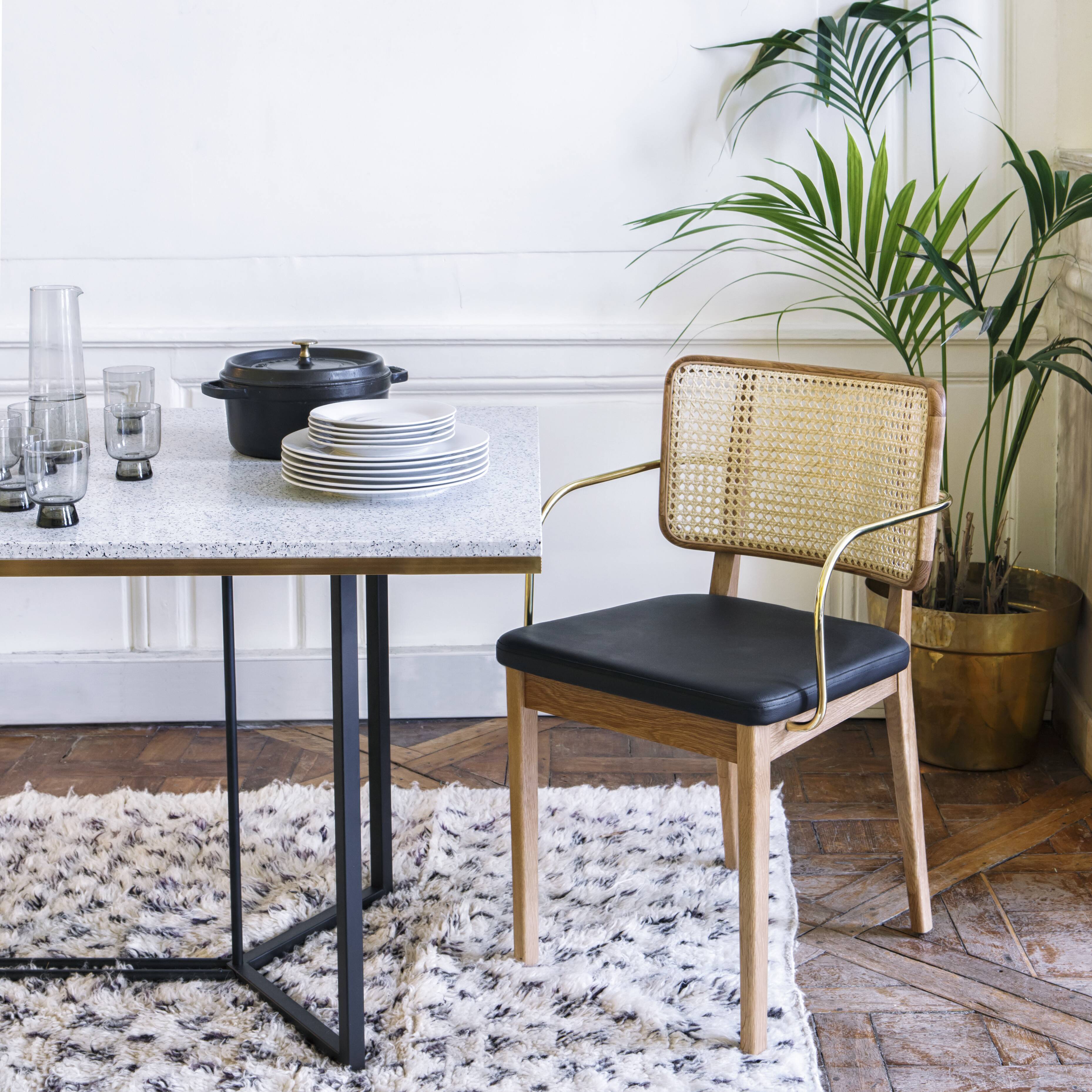 4 light wood canning chairs with black leather armrests