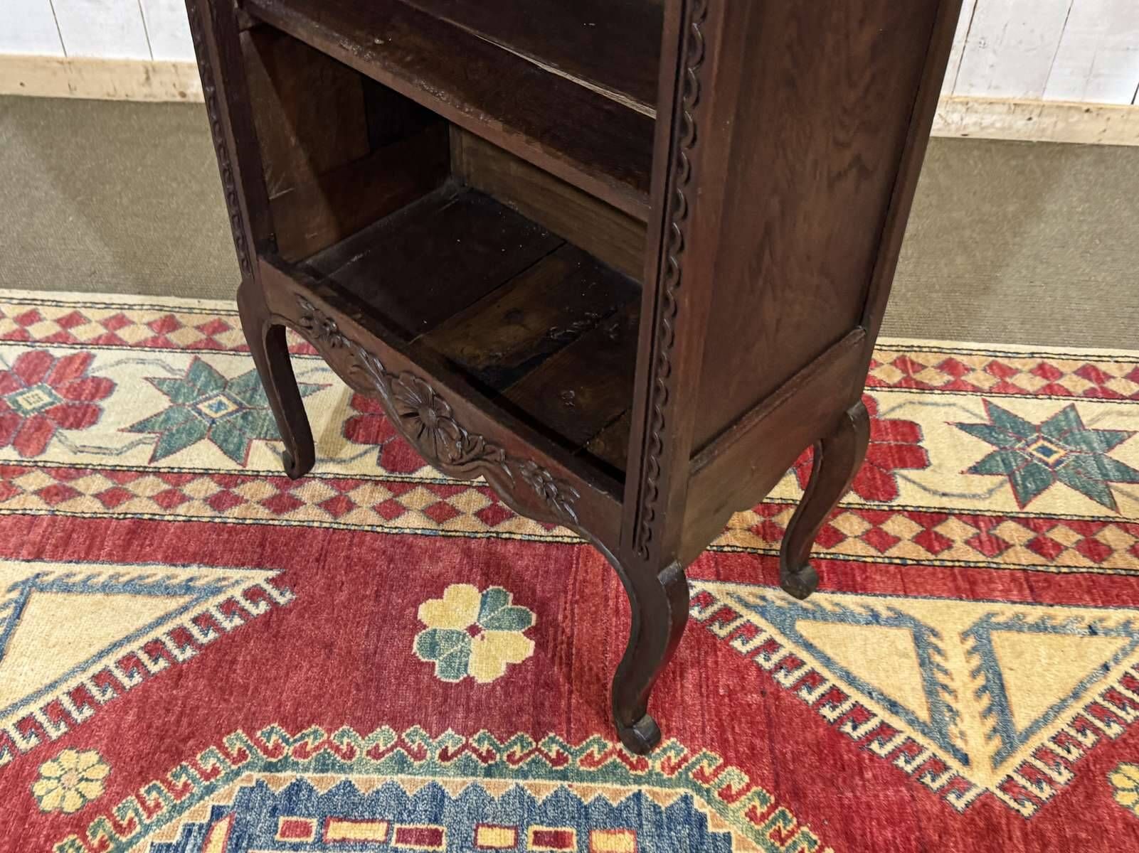 Oak accent furniture bookshelf with a drawer, early 20th century work.