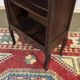 Oak accent furniture bookshelf with a drawer, early 20th century work.
