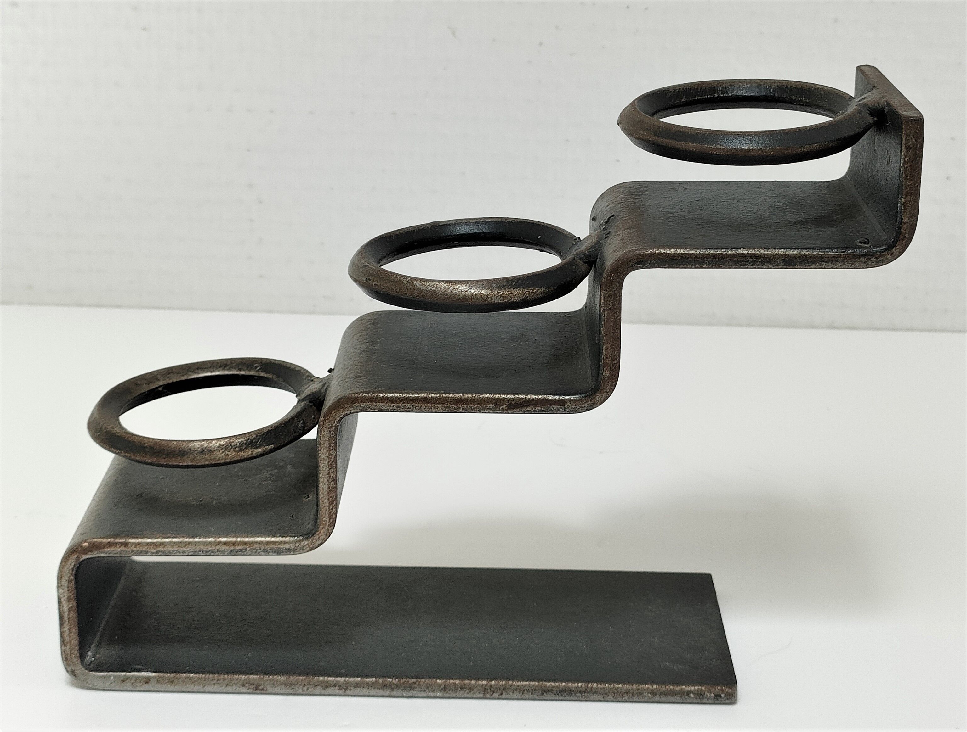 Sculptural candle holder patinated steel design 80s