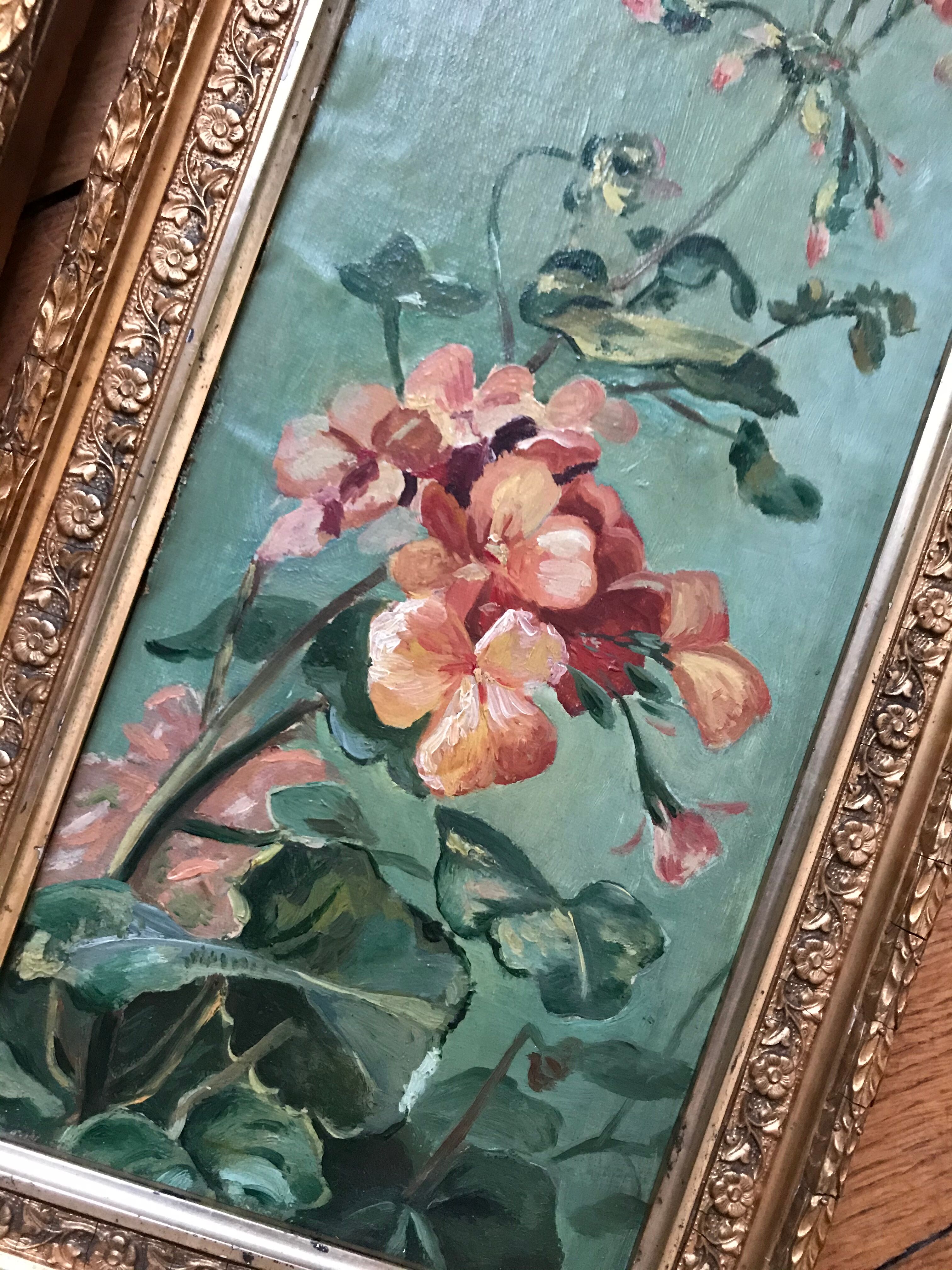 Two old paintings of flowers and gilded frames