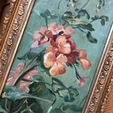 Two old paintings of flowers and gilded frames