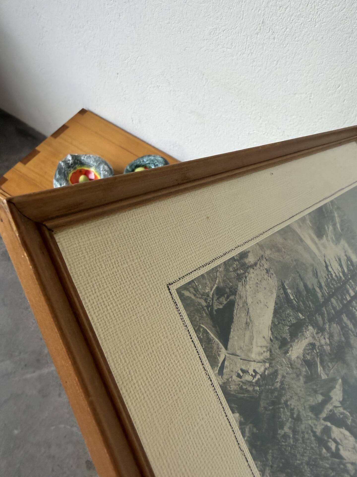 Framed old photo of a mountain landscape.