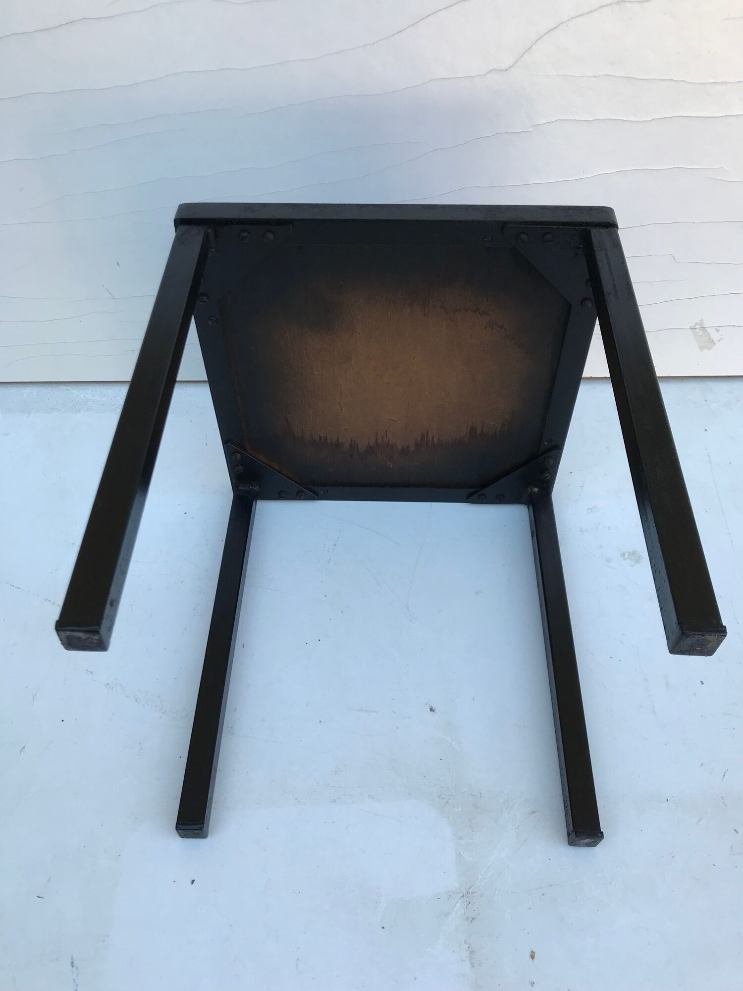 Old black metal and majolica tiles table