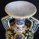 Art Deco ceramic vase with brightly colored abstract patterns
