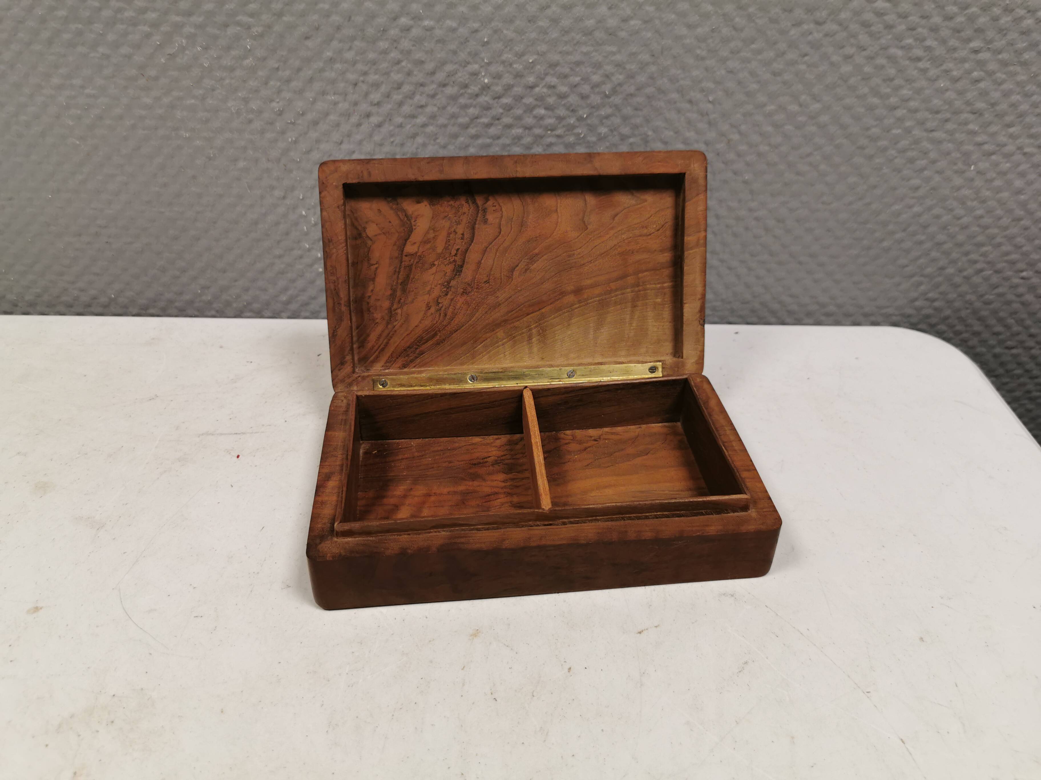 Wooden trinket box for storing jewellery, cigarettes or similar items.