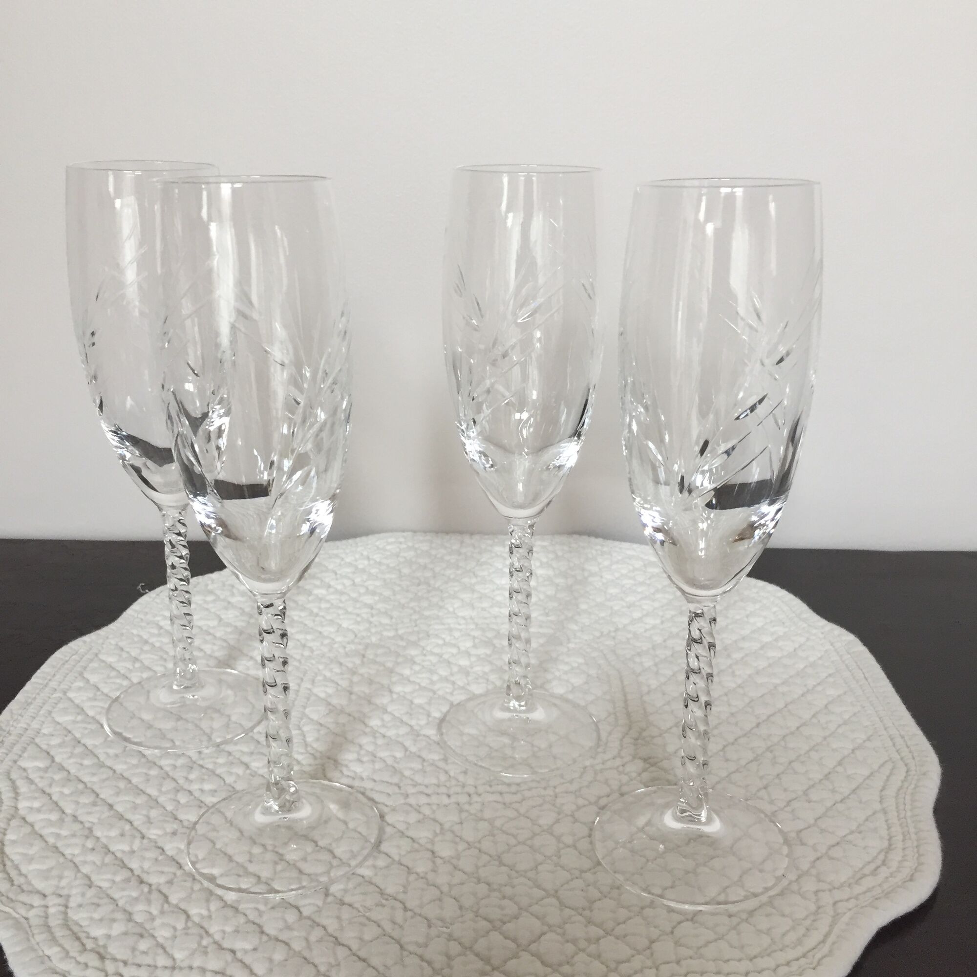 Four crystal champagne flutes engraved wheat cob patterns