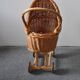 Brown wicker doll stroller on a wooden frame, wooden wheels — vintage (1890-1919)