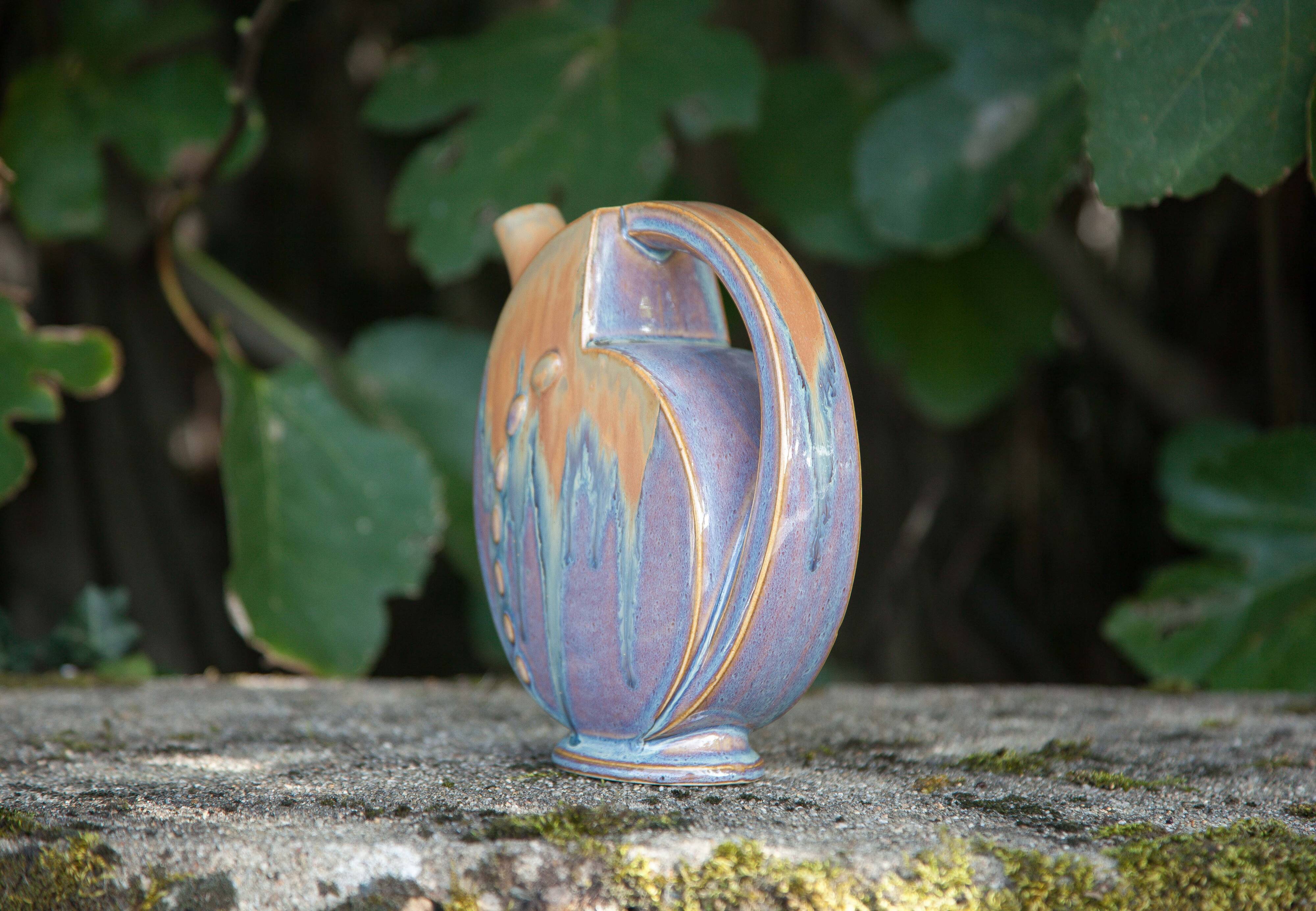 Flamed enameled stoneware bottle, pitcher, liquor bottle signed Denbac number 610, art vase