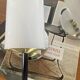 Pair of vintage wall sconces in plexiglass plastic and brass.