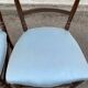 2 Napoleon III chairs in solid wood and blue satin fabric.