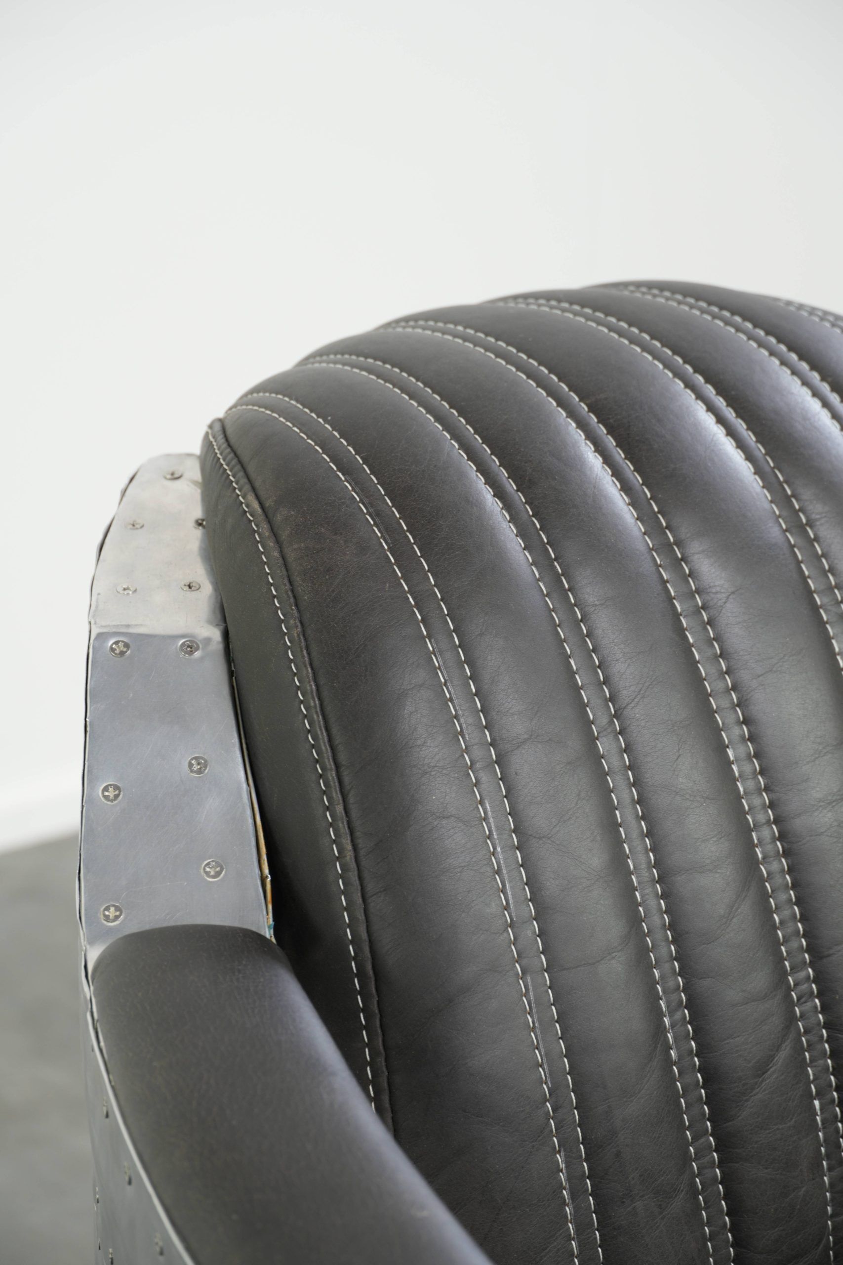Set of 2 sturdy industrial black cowhide Aviator design armchairs with aluminium and rivets