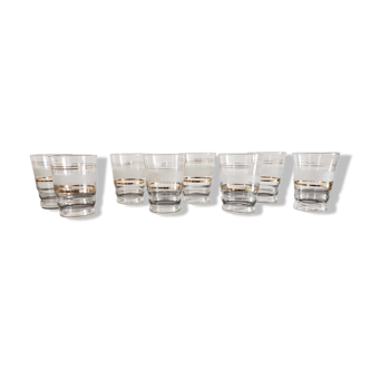 8 glasses with white granite band and gold edging from the 1950s