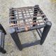 5 blackened wooden stools with woven leather seats by Nina Kaufmann