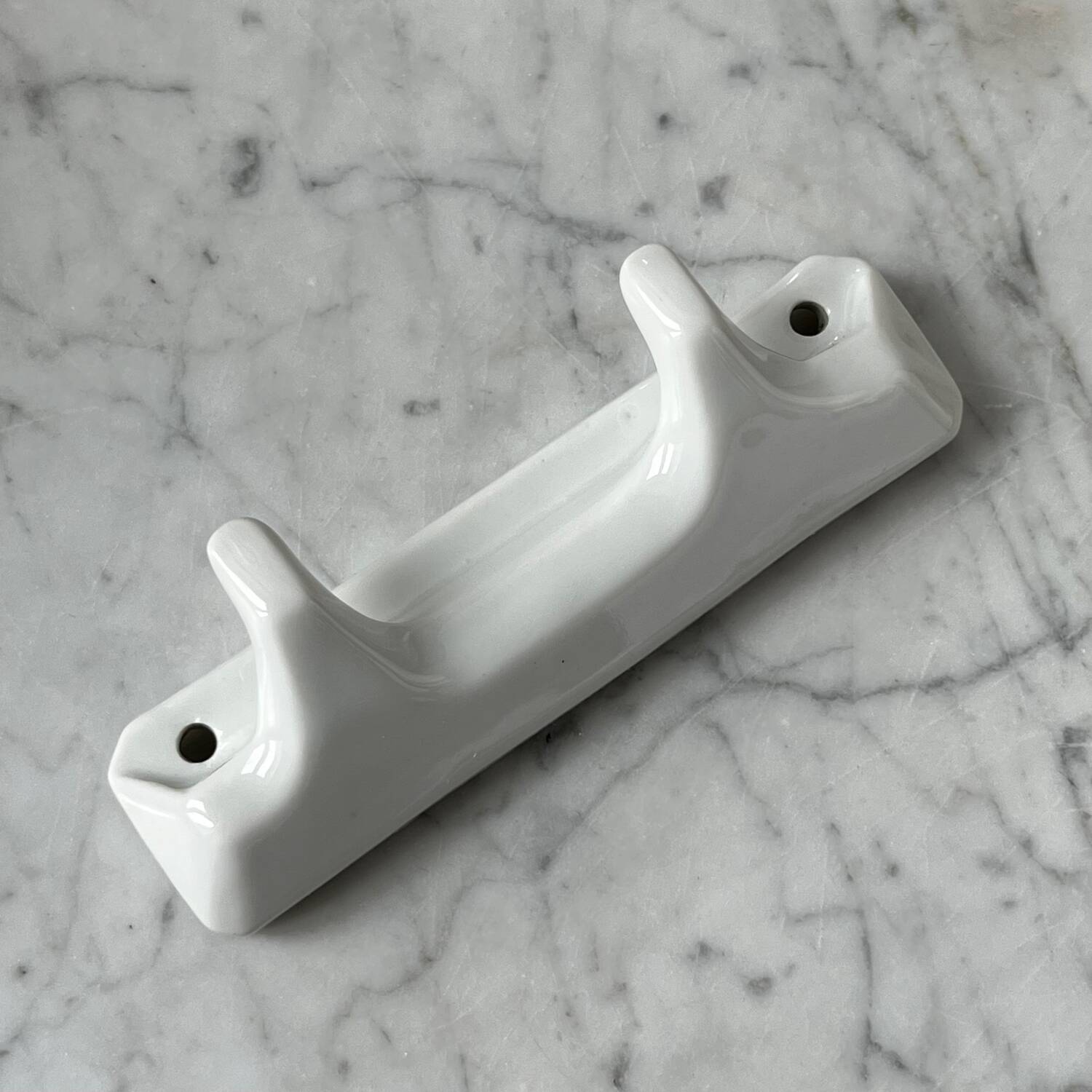 White porcelain coat hooks