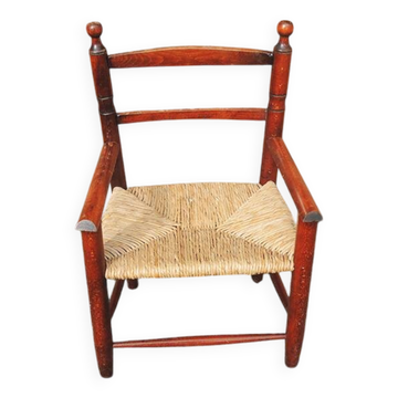Old straw armchair for children