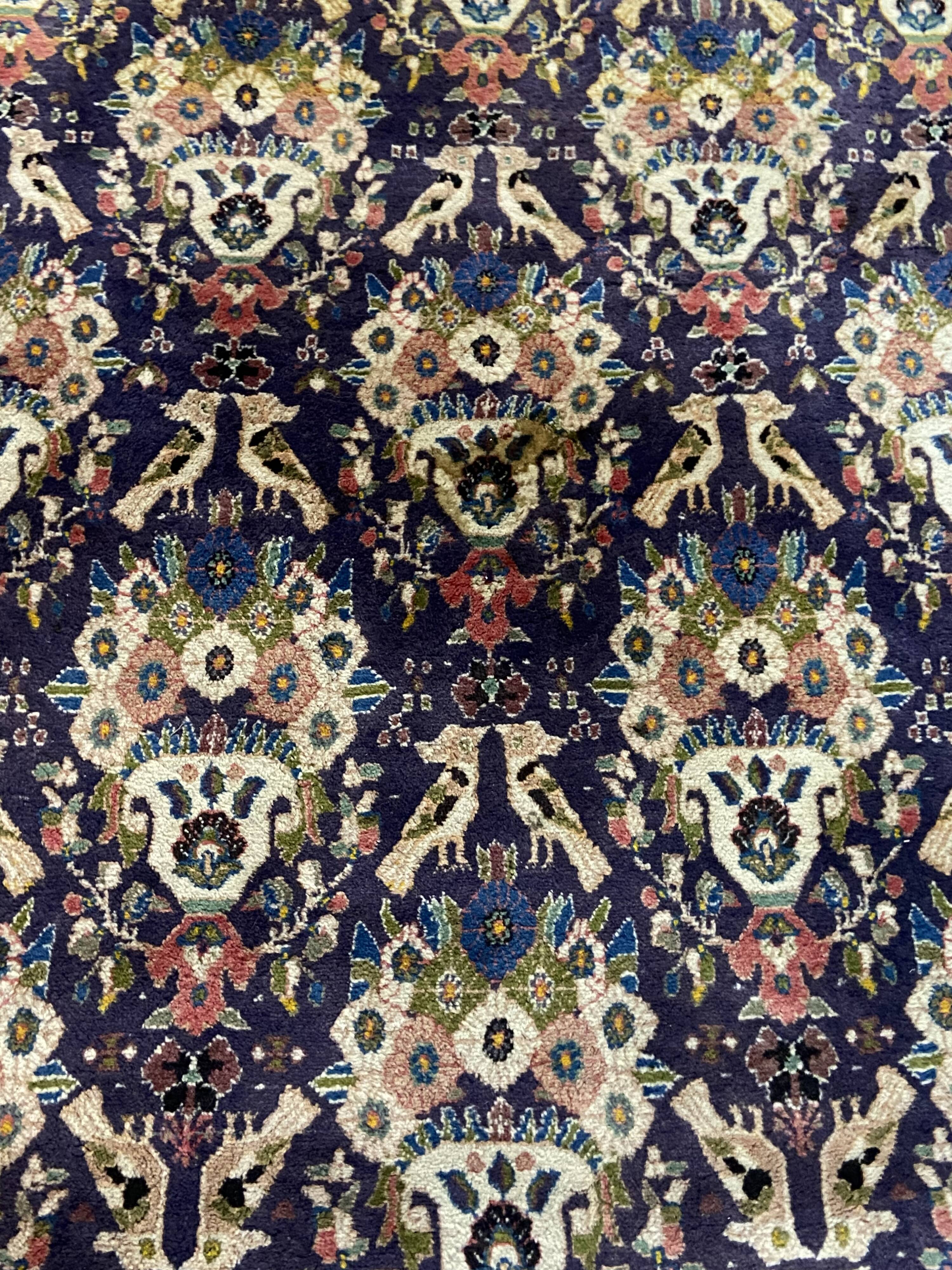 Antique Oriental rug from a nomadic tribe, 1950-1980, birds on a purple background