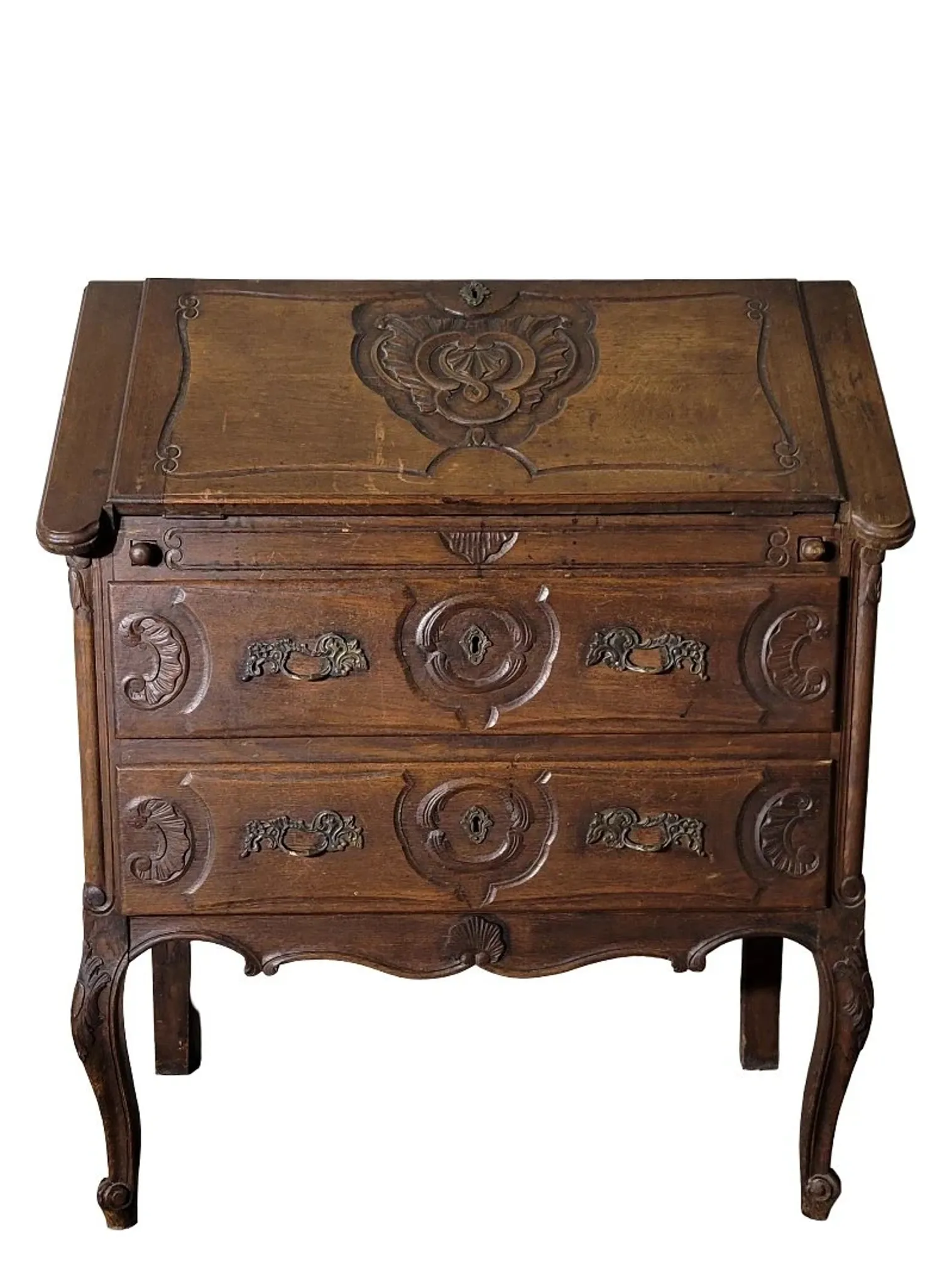 Antique solid wood secretary richly carved, in the Louis XV style.