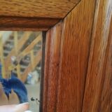 Large old mirror in solid oak