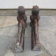 Pair of antique women's head cast iron chenets