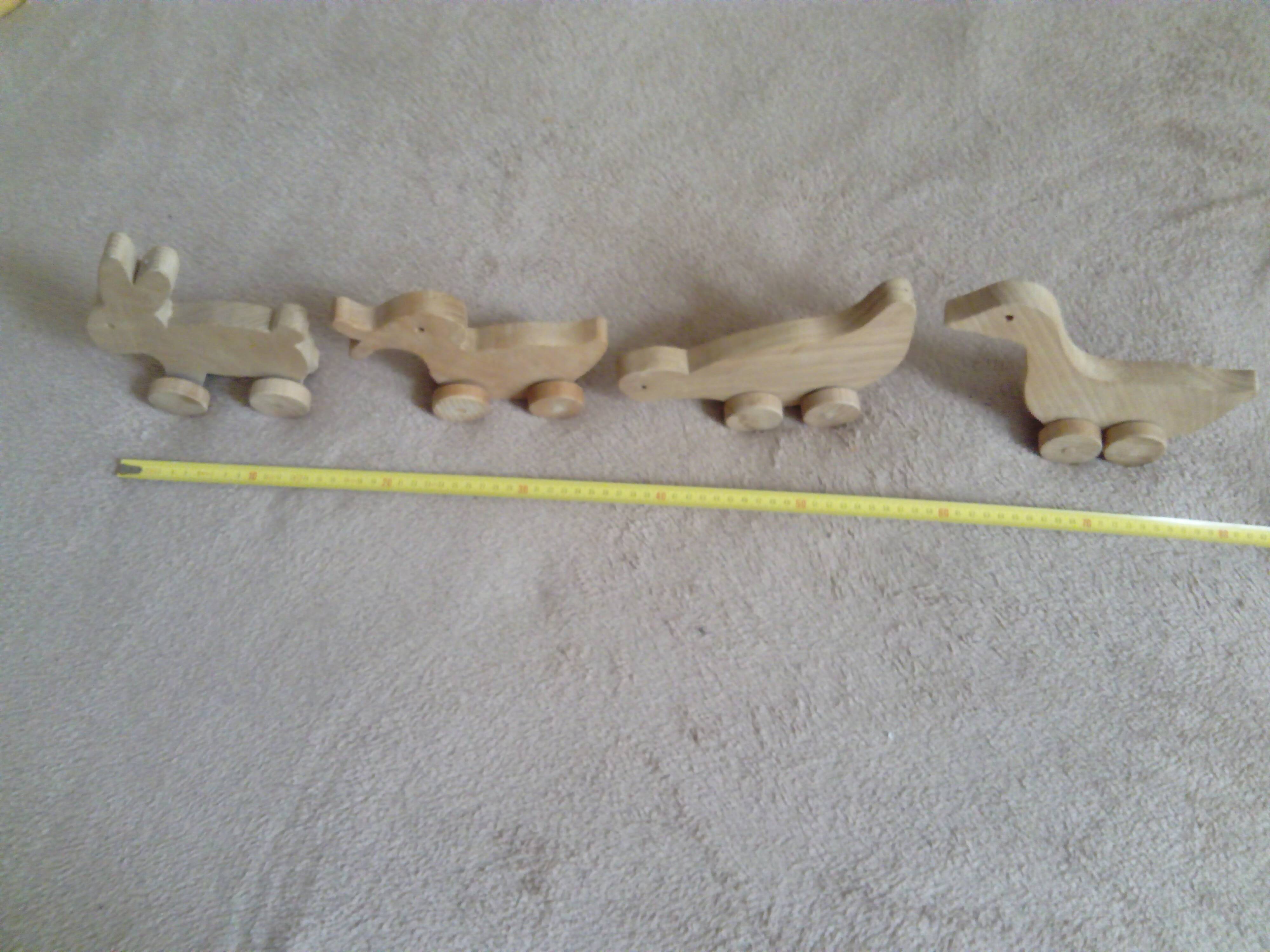 set of 4 wooden toys on wheels