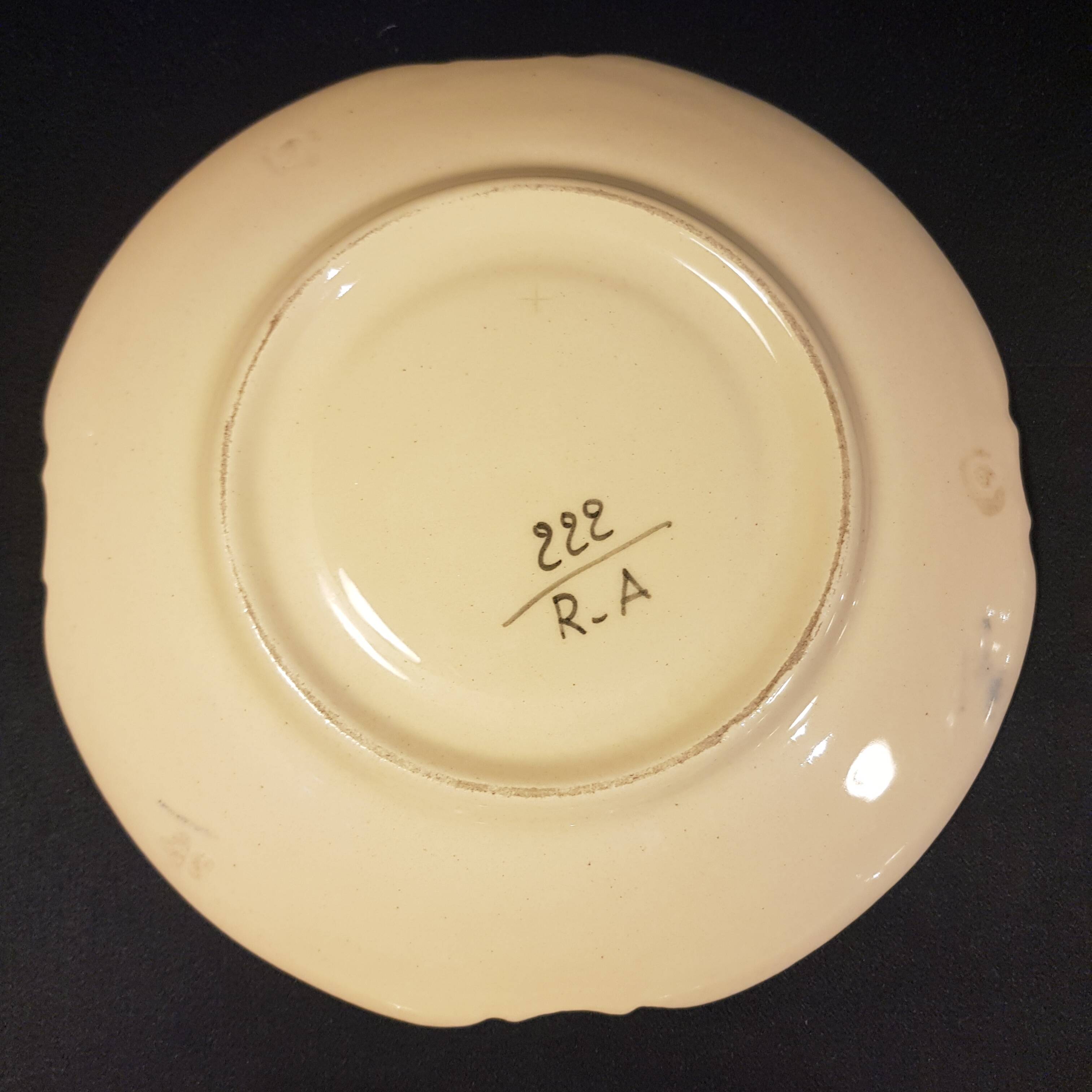 4 Quimper earthenware saucers or plates
