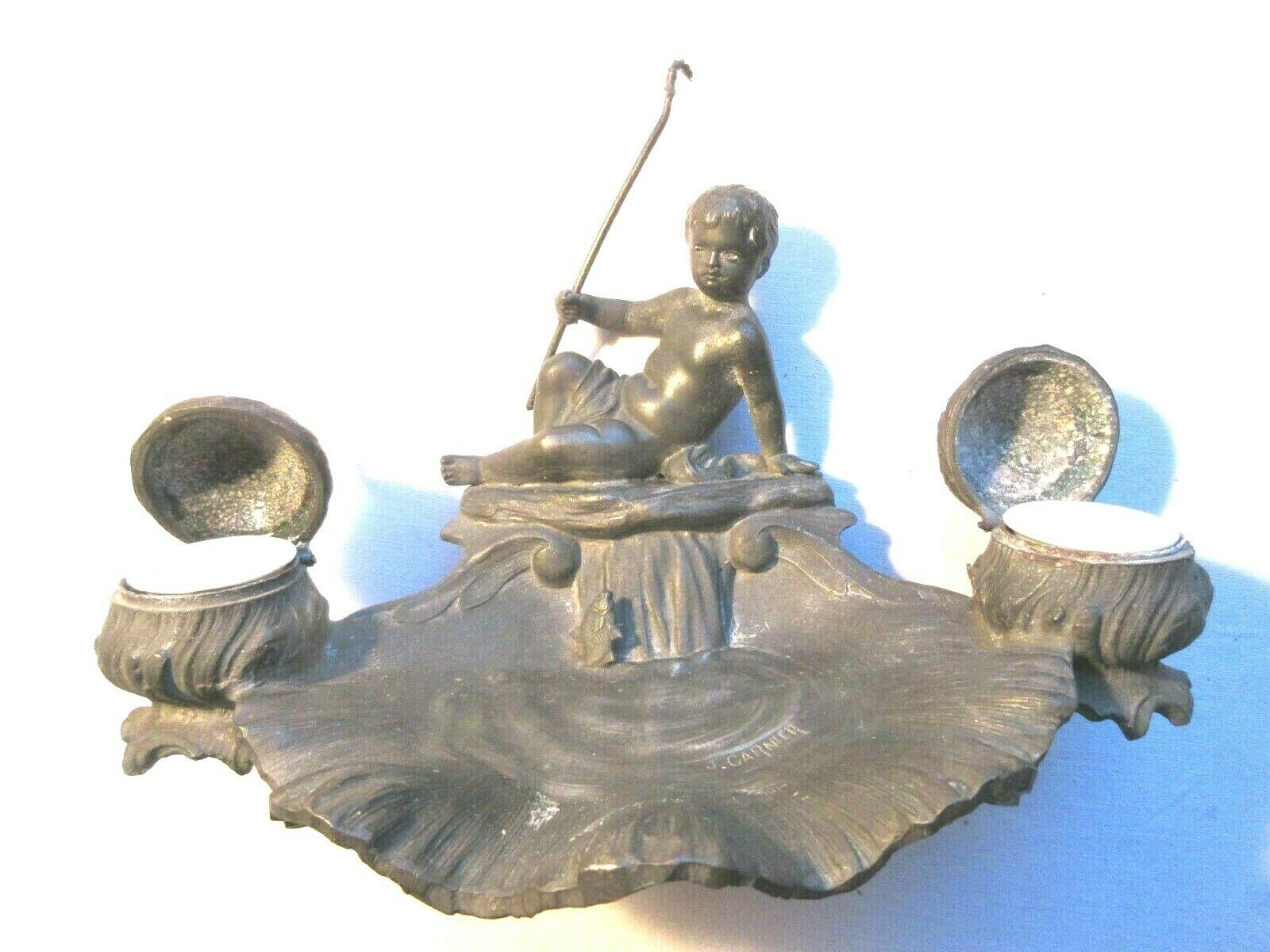 Double ink out 19th in tin signed J. GARNIER: The Cherub fisherman