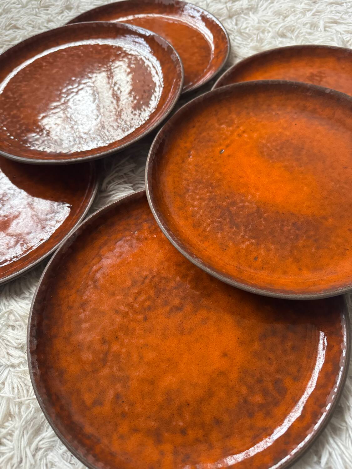 Orange glazed ceramic plates from the 1970s