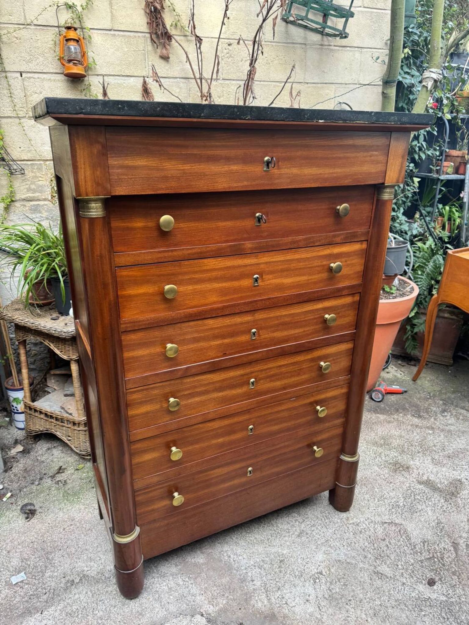 Empire chest of drawers in mahogany and black marble, 19th century