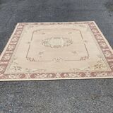Persian rug in beige wool with woven flowers 290x190cm