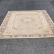 Persian rug in beige wool with woven flowers 290x190cm