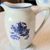 Blue and white ceramic coffee service with flowers.