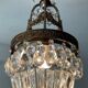 Old bronze basket chandelier with tassels