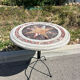Round marble table with marble inlay