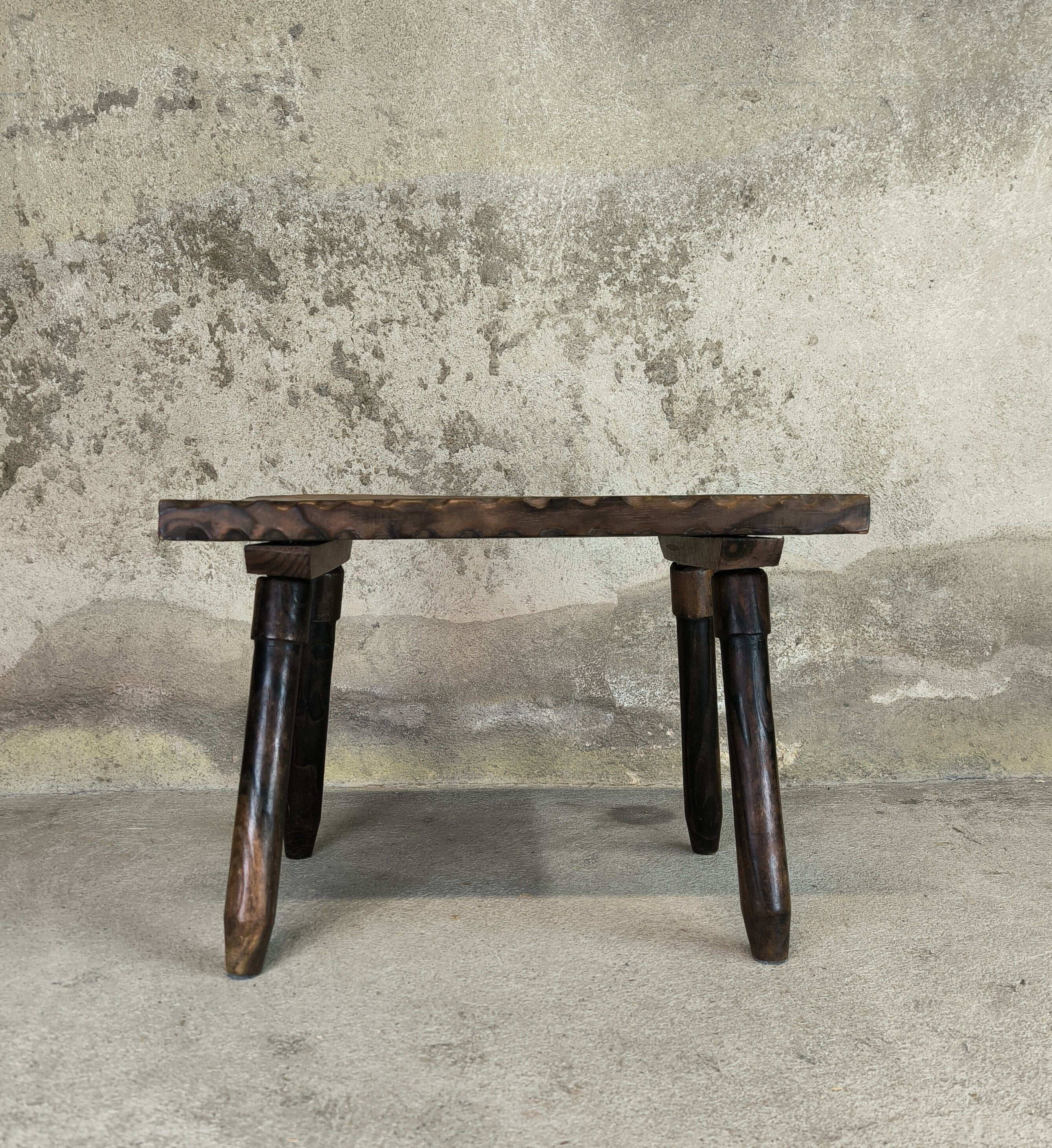 Small vintage coffee table made of solid wood.