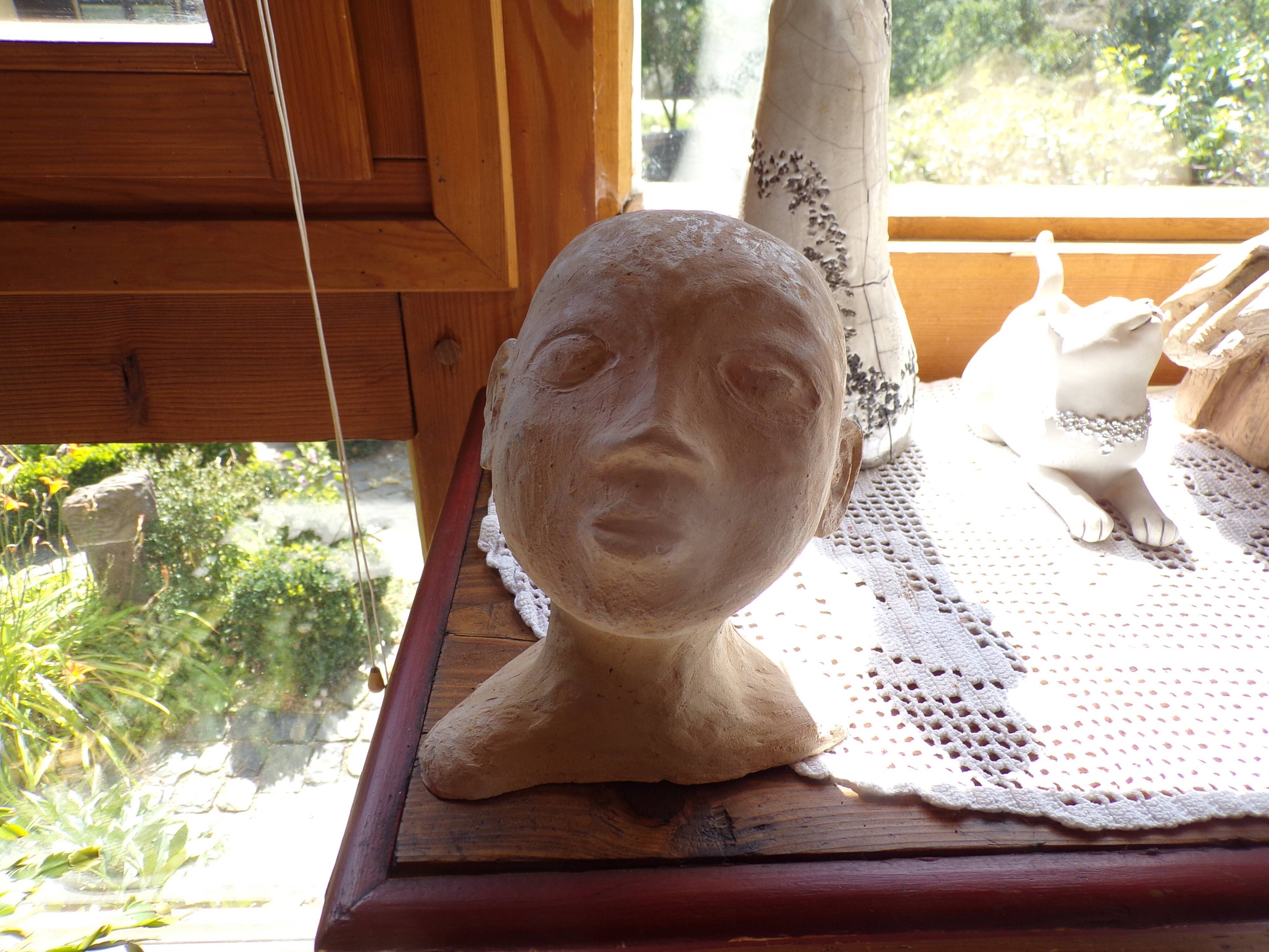 Child bust in terracotta