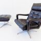 Danish black leather armchair with ottoman 70s