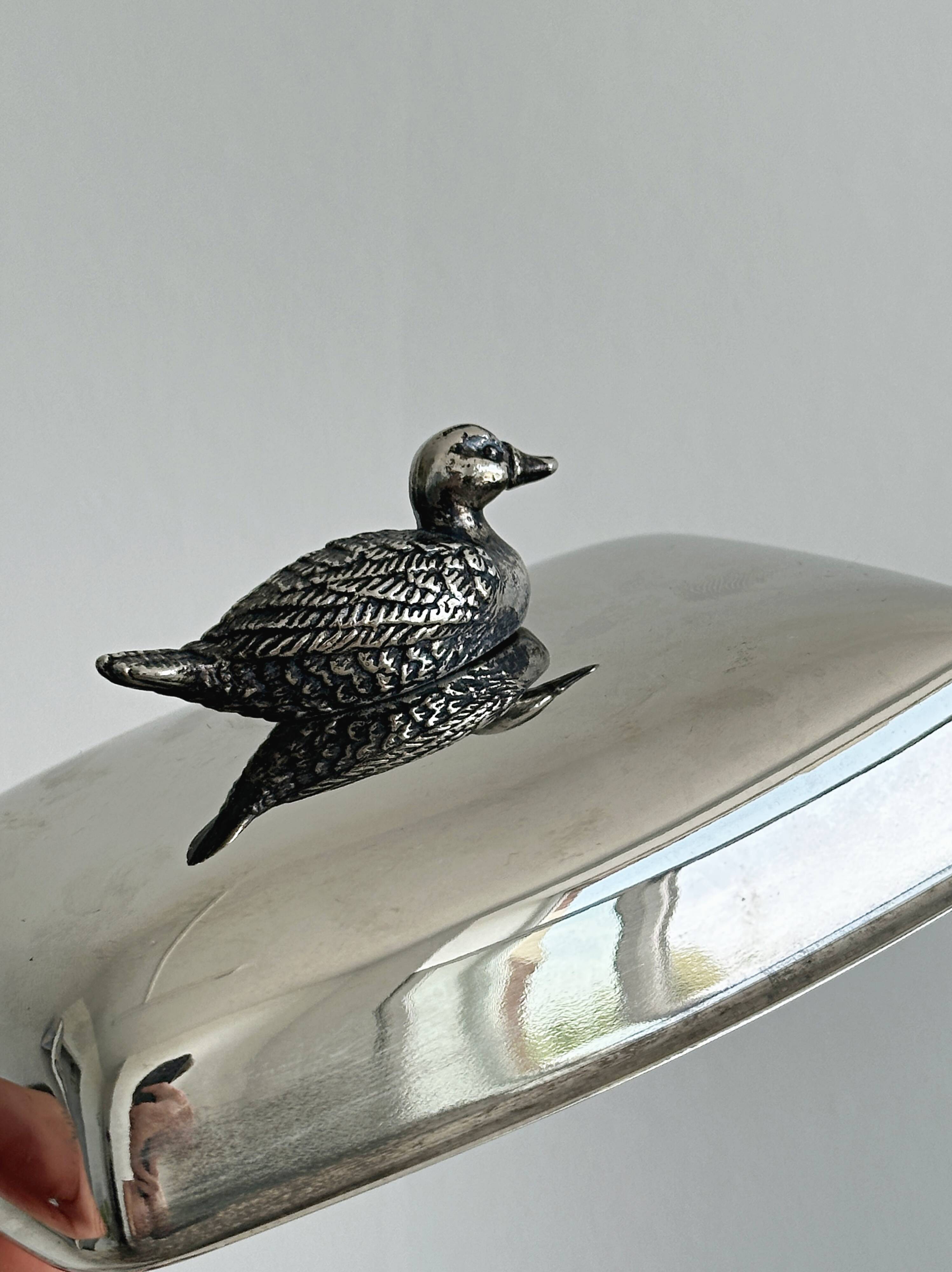 Antique shiny metal butter dish