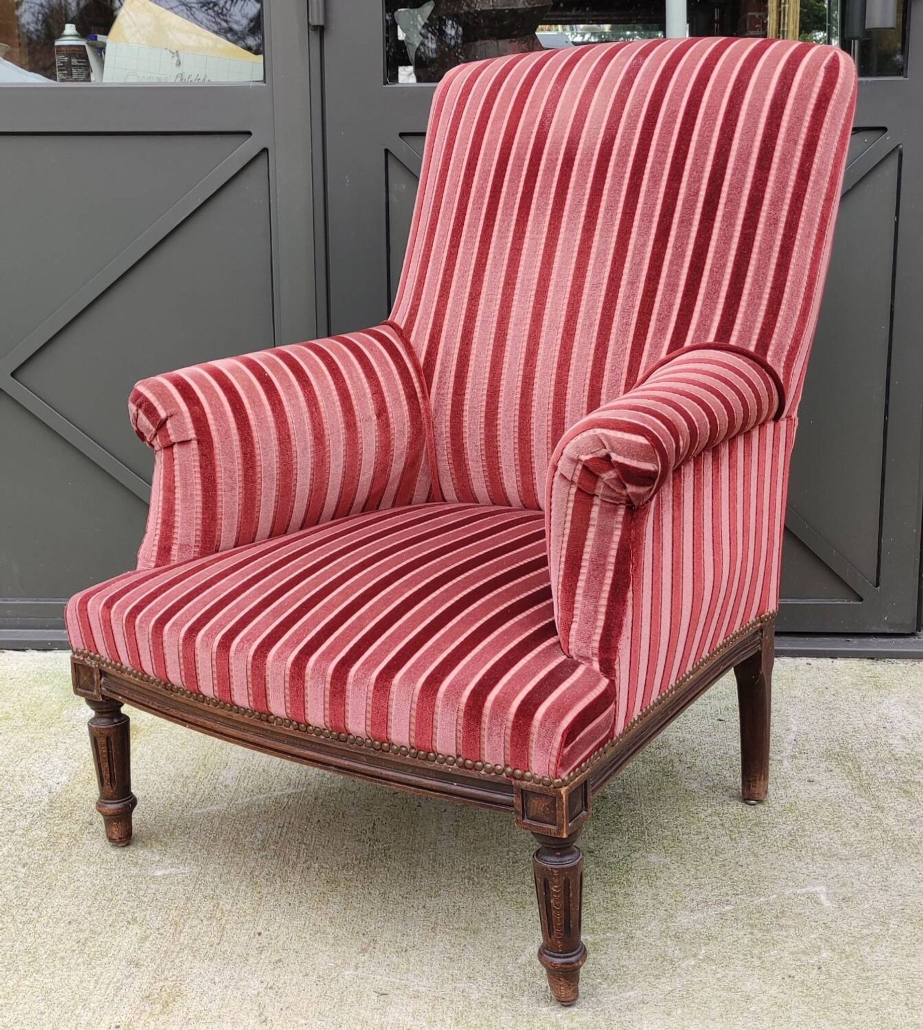 Old armchair and its Louis XVI style footrest/velvet covering