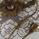 Vintage French bronze Wee Willie Winkie style lamp with red card shade.