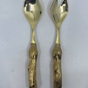 Lot of serving spoons, dessert spoon and fork in gold metal.