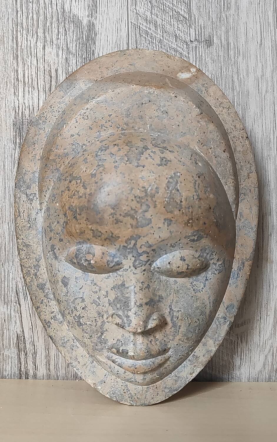 African stone face sculpture