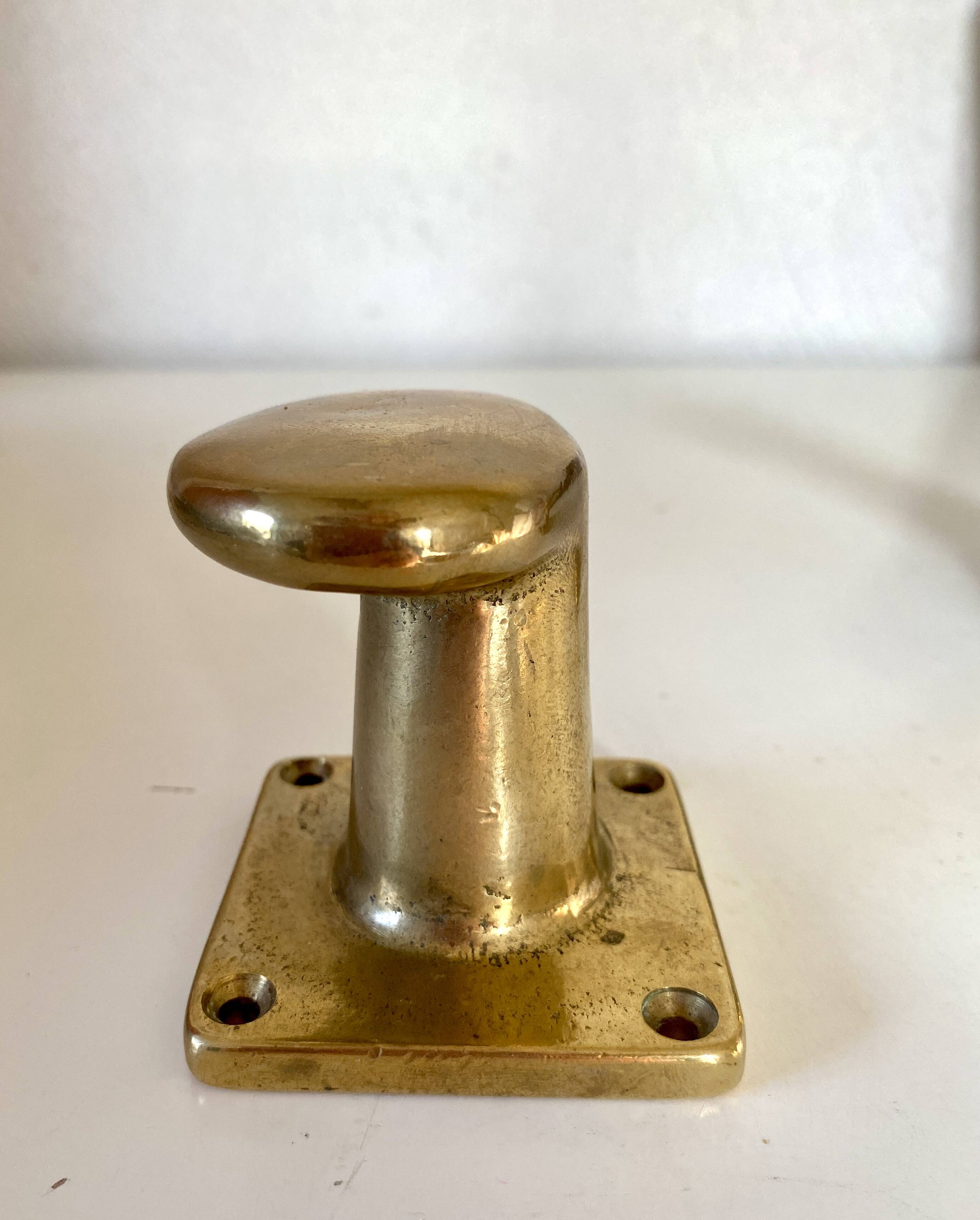 Pair of golden cast iron hooks