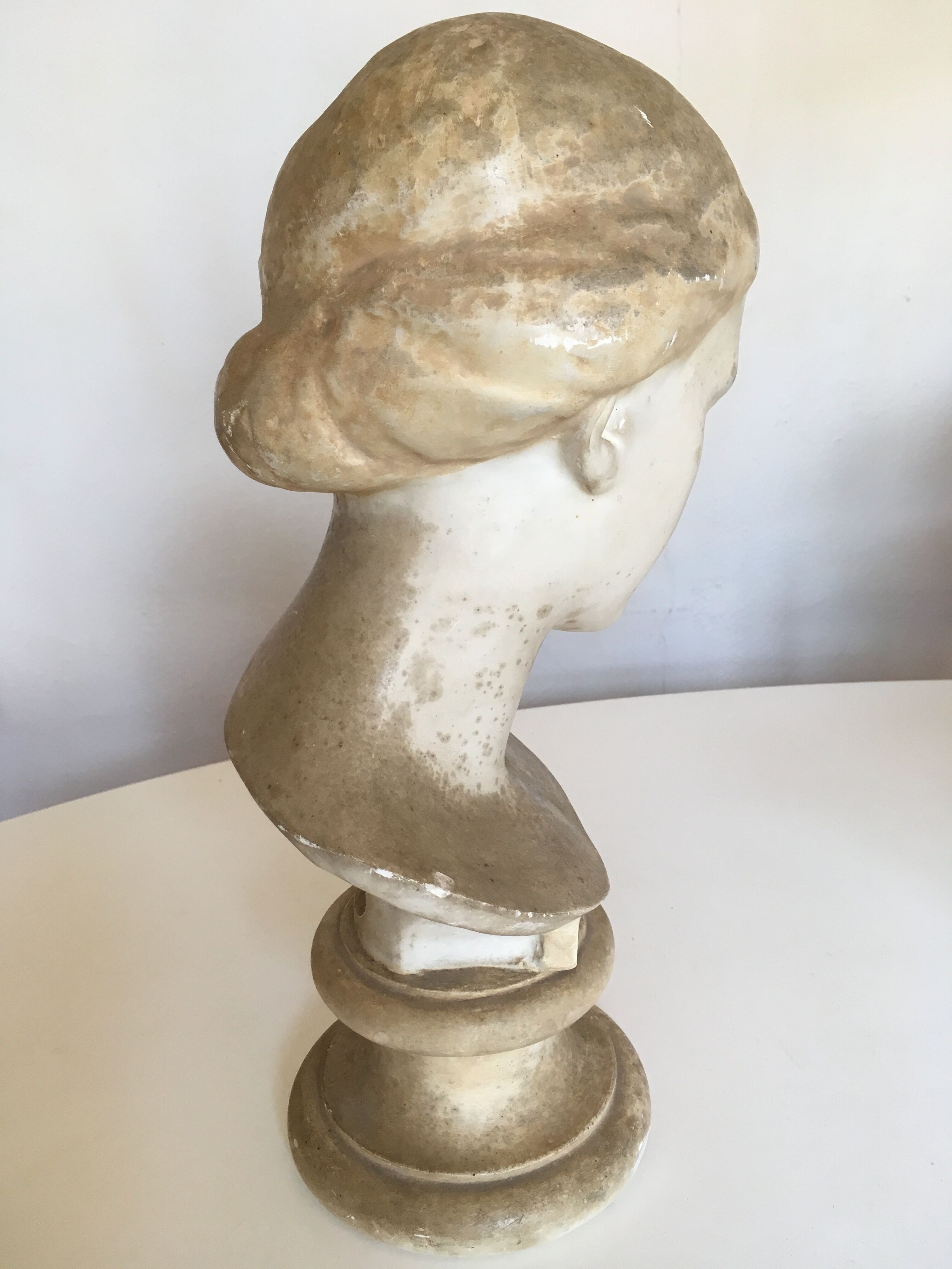 Former girl bust end 19th in plaster cast on its base