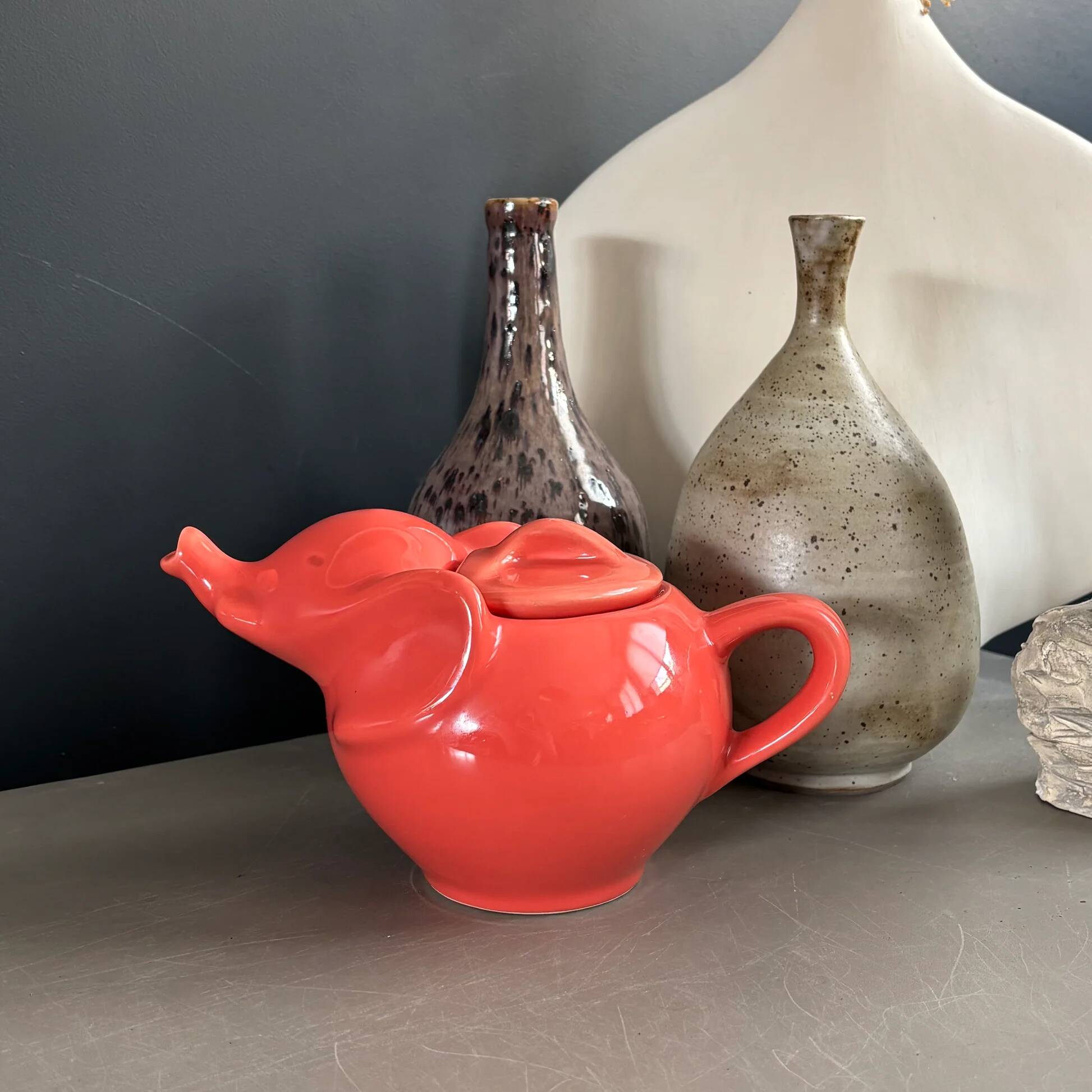 Large coral-coloured elephant teapot.