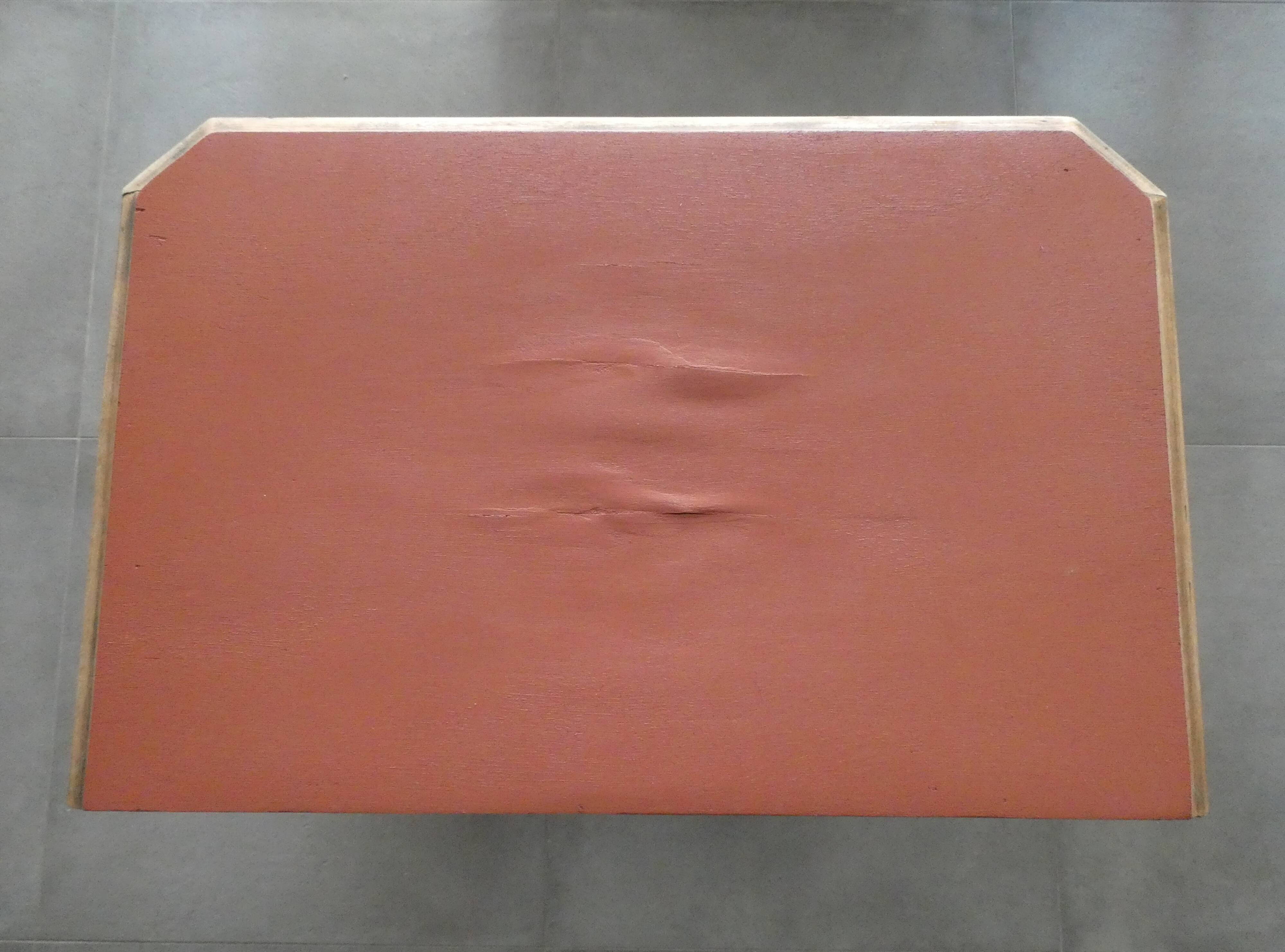 Console, small red accent table.