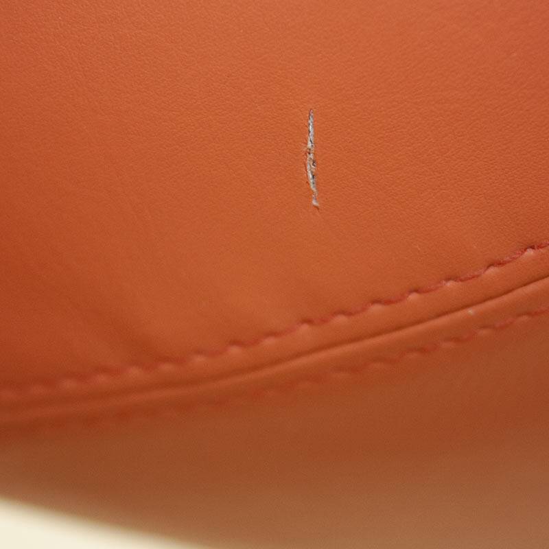 Open armchair in orange leather by Allermuir