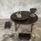 Coffee table, round antique Indonesian teak table with straight legs.