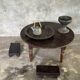 Coffee table, round antique Indonesian teak table with straight legs.